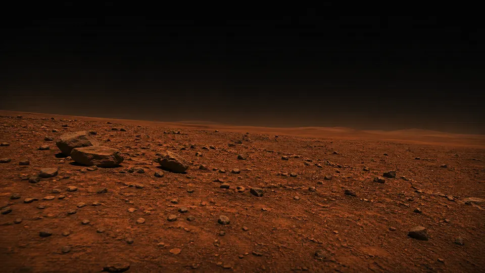 Left hazard-camera view of orange Martian regolith scattered with dark rocks.